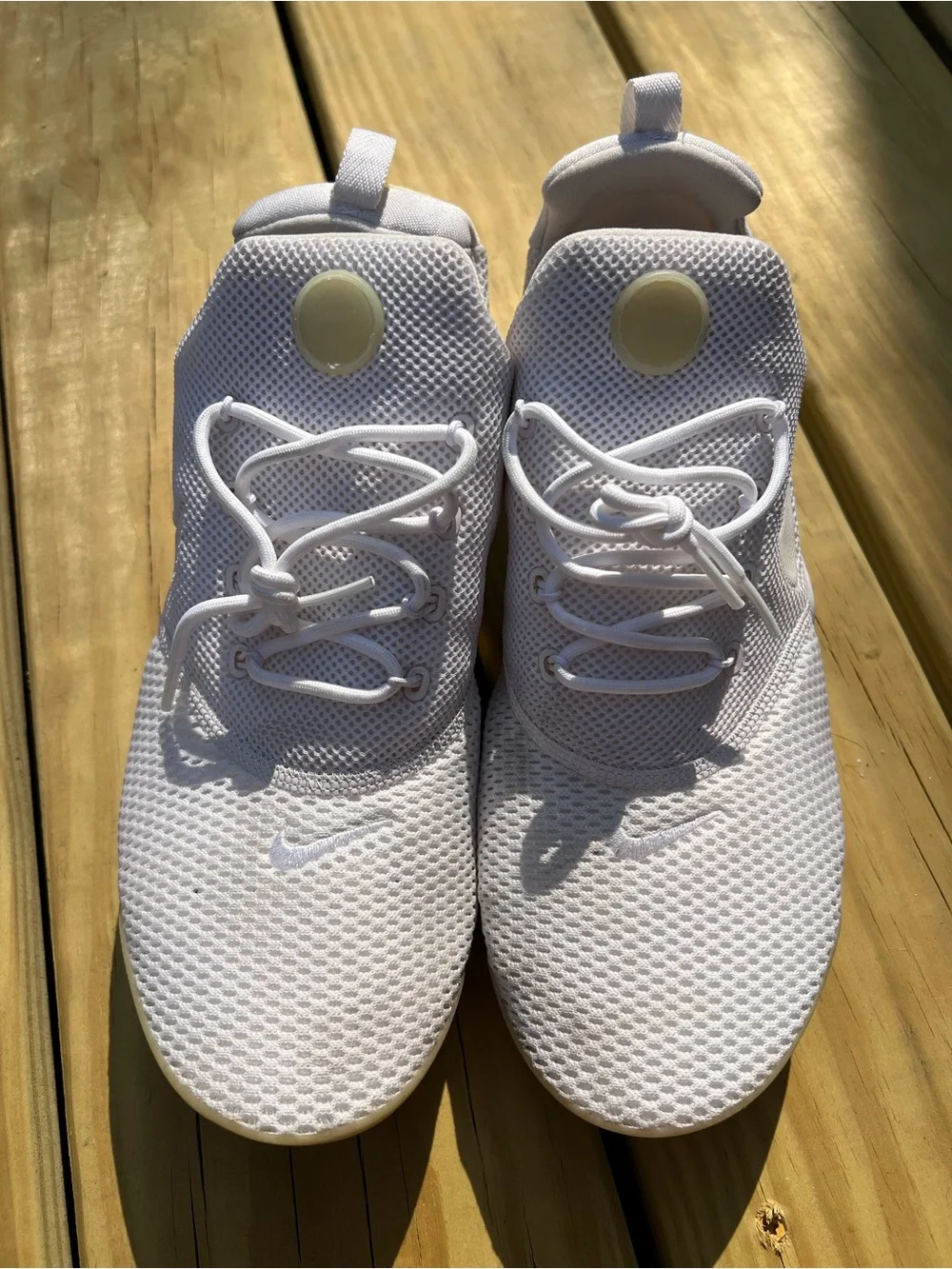 Nike Women’s White Mesh Sneakers with Cream Accents.